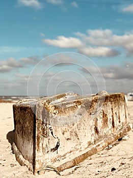 A turned over rusty boat on the beaches of Progreso on Mexico`s YucatÃÂ¡n Peninsula photo